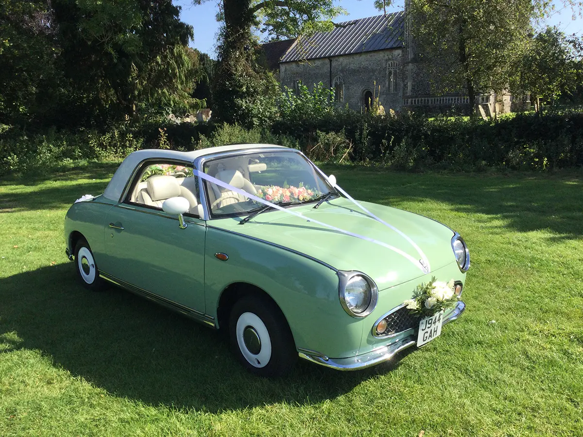 Front view of a Nissan Figaro bridal car