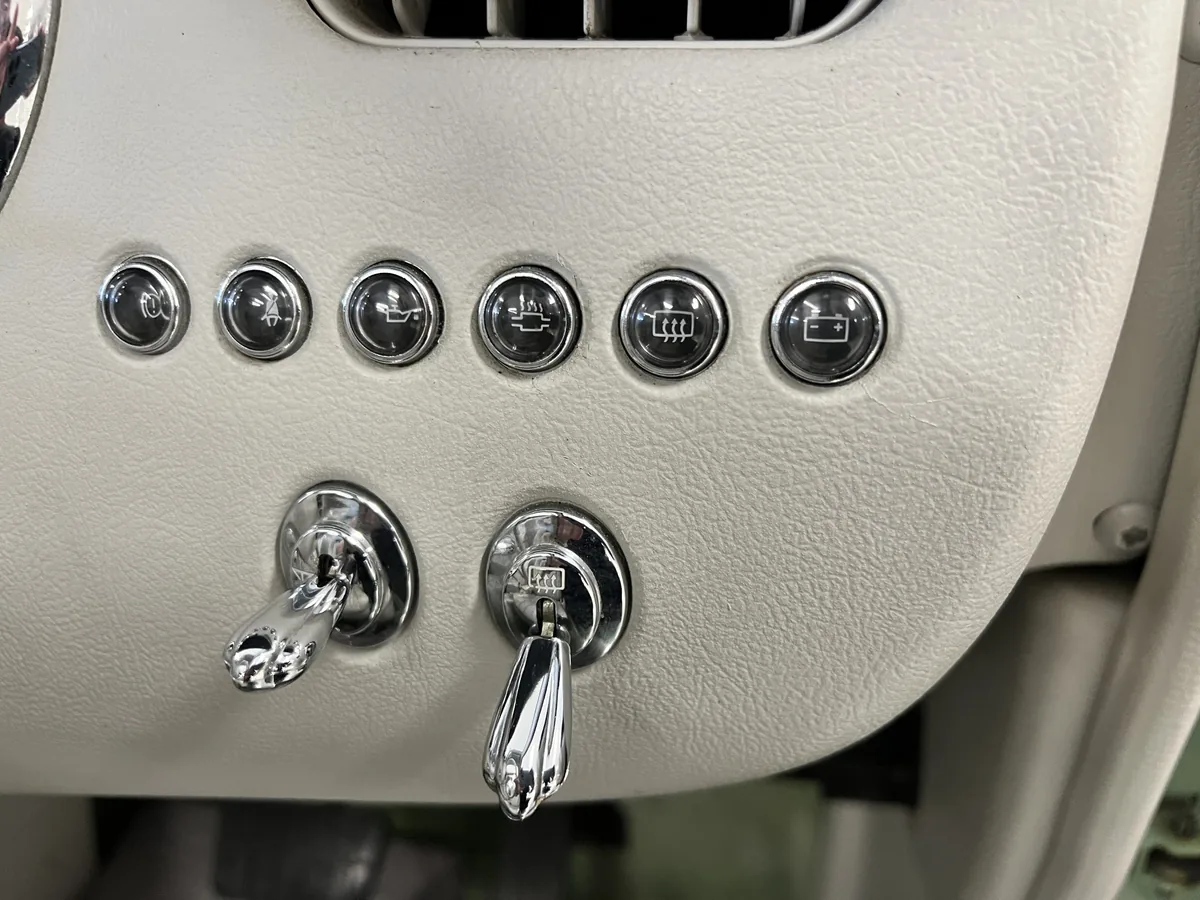 Dashboard switches and CD player in a Nissan Figaro
