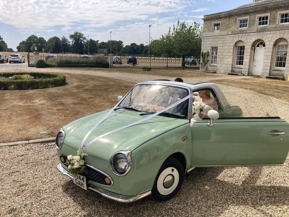 Nissan Figaro wedding car on the drive at Woolverstone Hall, Ipswich